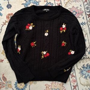 Elegant Black Sweater with Floral Accents